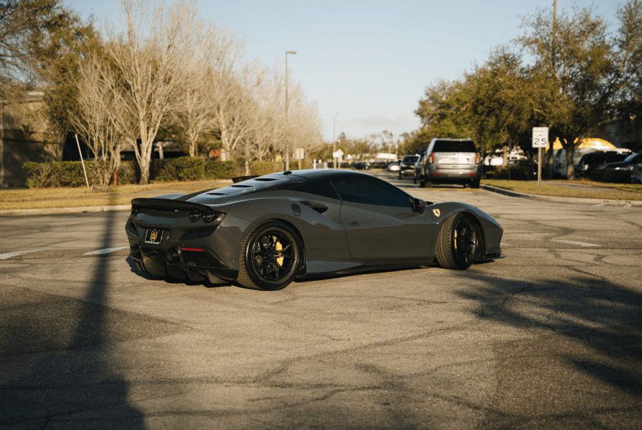 2020 Ferrari F8 Tributo parked on a street showcasing its sleek design and powerful stance.