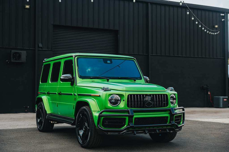 2022 Mercedes G63 AMG (Brabus Kit) in vibrant green parked in Tampa, showcasing luxury and power.