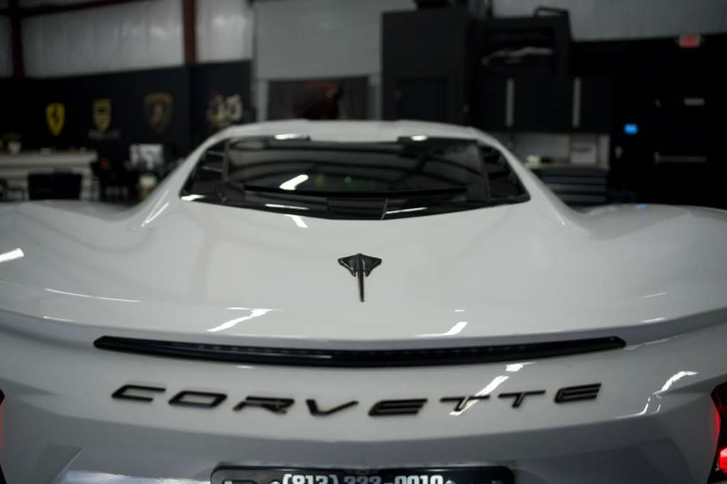 2023 Corvette C8 in Arctic White showcasing sleek design and luxury features.