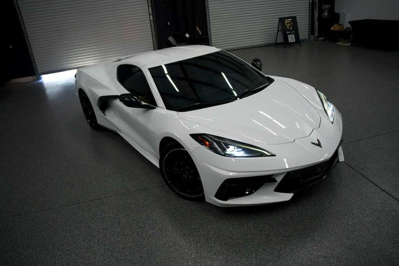 2023 Corvette C8 in Arctic White showcasing sleek design and modern features.