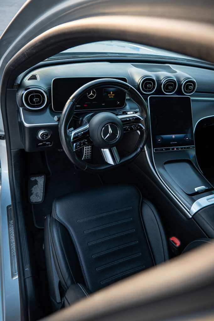 2024 Mercedes C300 interior featuring luxurious leather seating and advanced MBUX infotainment system.