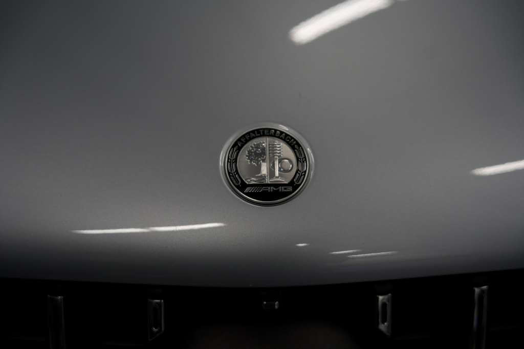 2024 Mercedes GLE 63S badge emblem on the front grille, showcasing luxury and performance.
