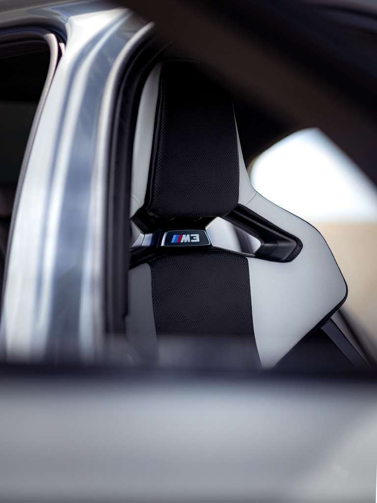 2026 BMW M3 Competition interior showing a sporty driver's seat with M3 logo