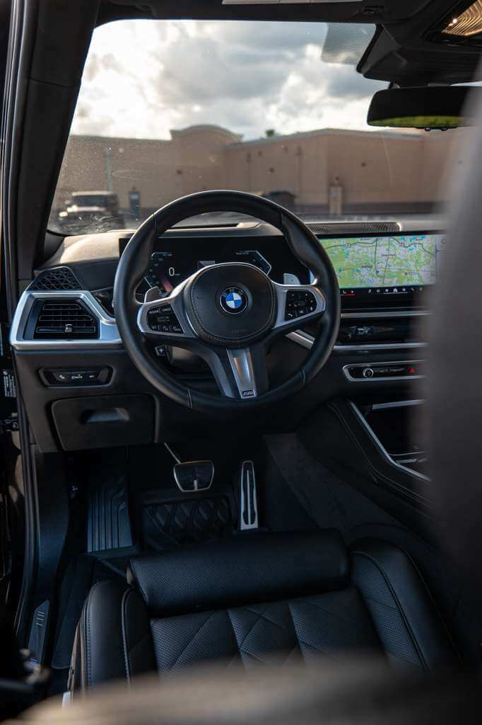 Interior view of the 2026 BMW X6 featuring a sleek dashboard and luxurious seating.