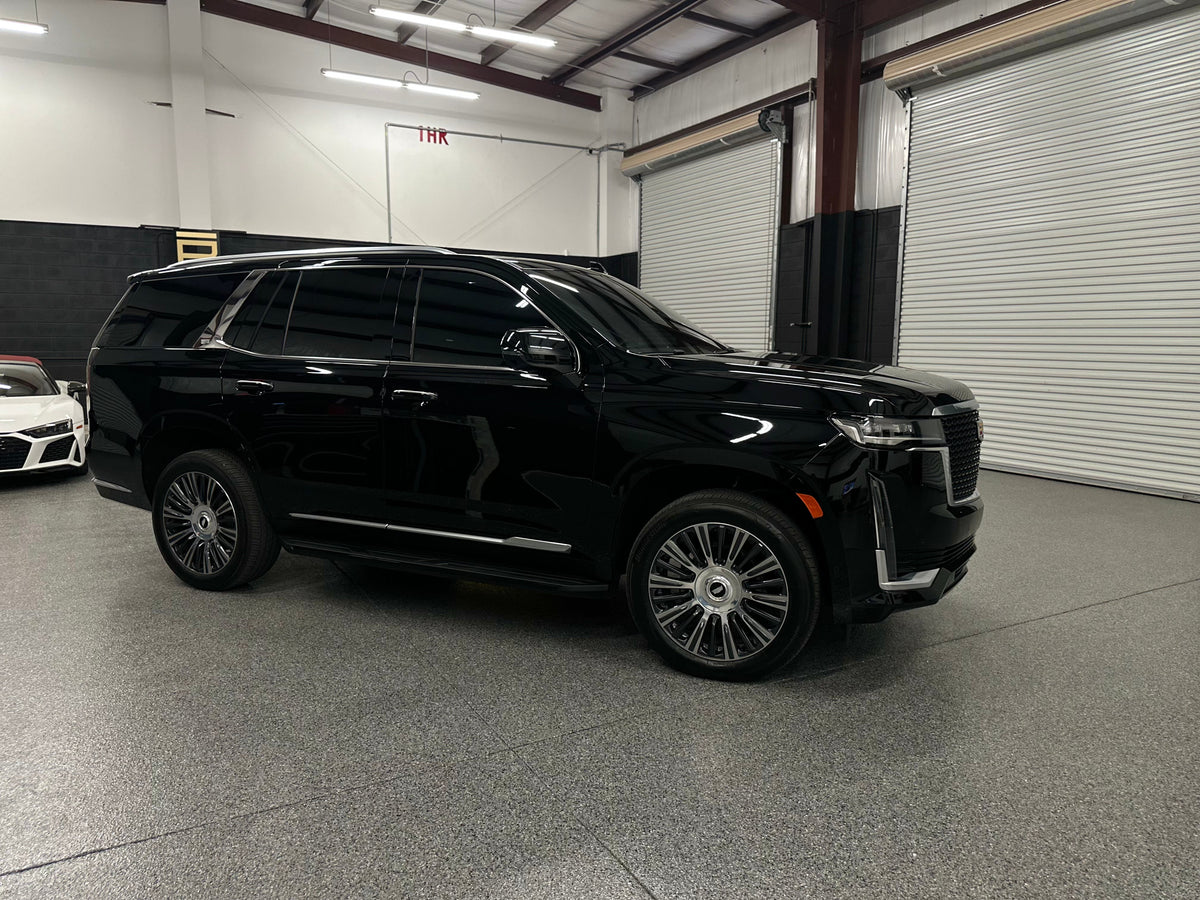 Black luxury full-size SUV with tinted windows and stylish alloy wheels ...