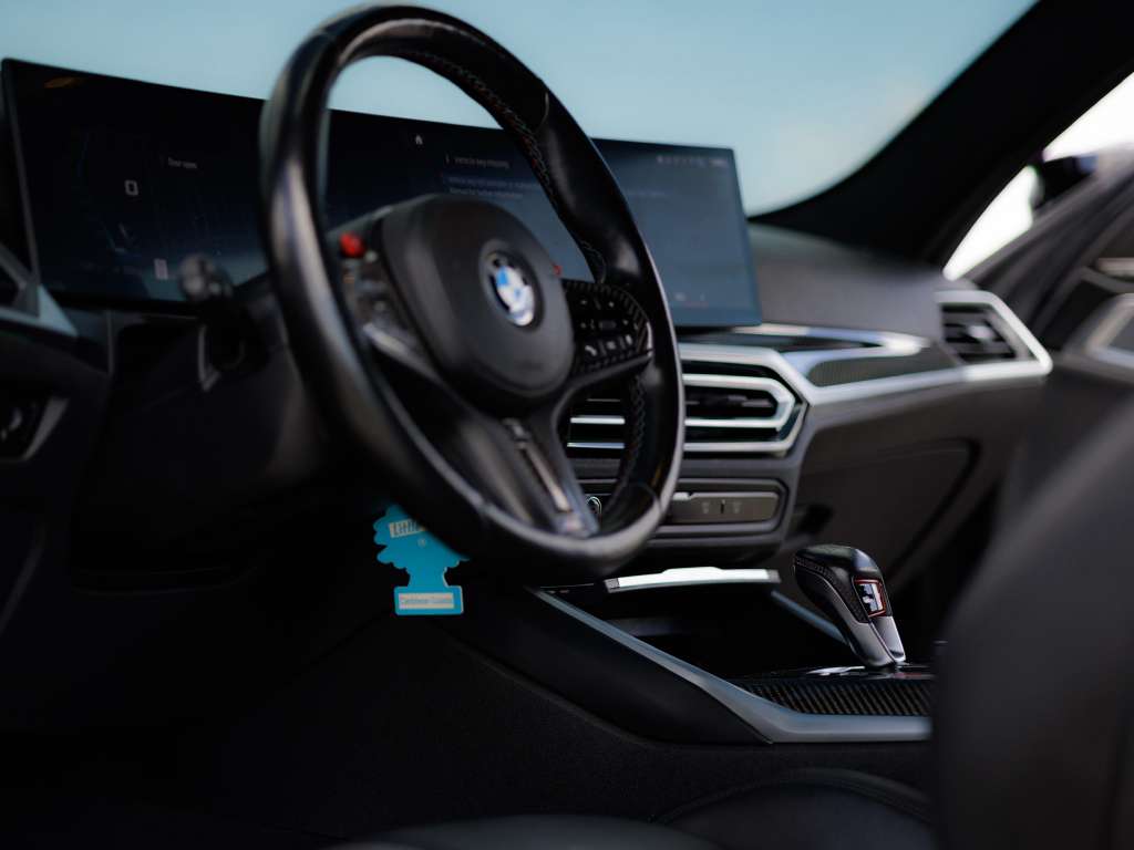 BMW M4 Competition interior and exterior detail available for rental in Orlando — $499 per day all-inclusive at Royal International Cars