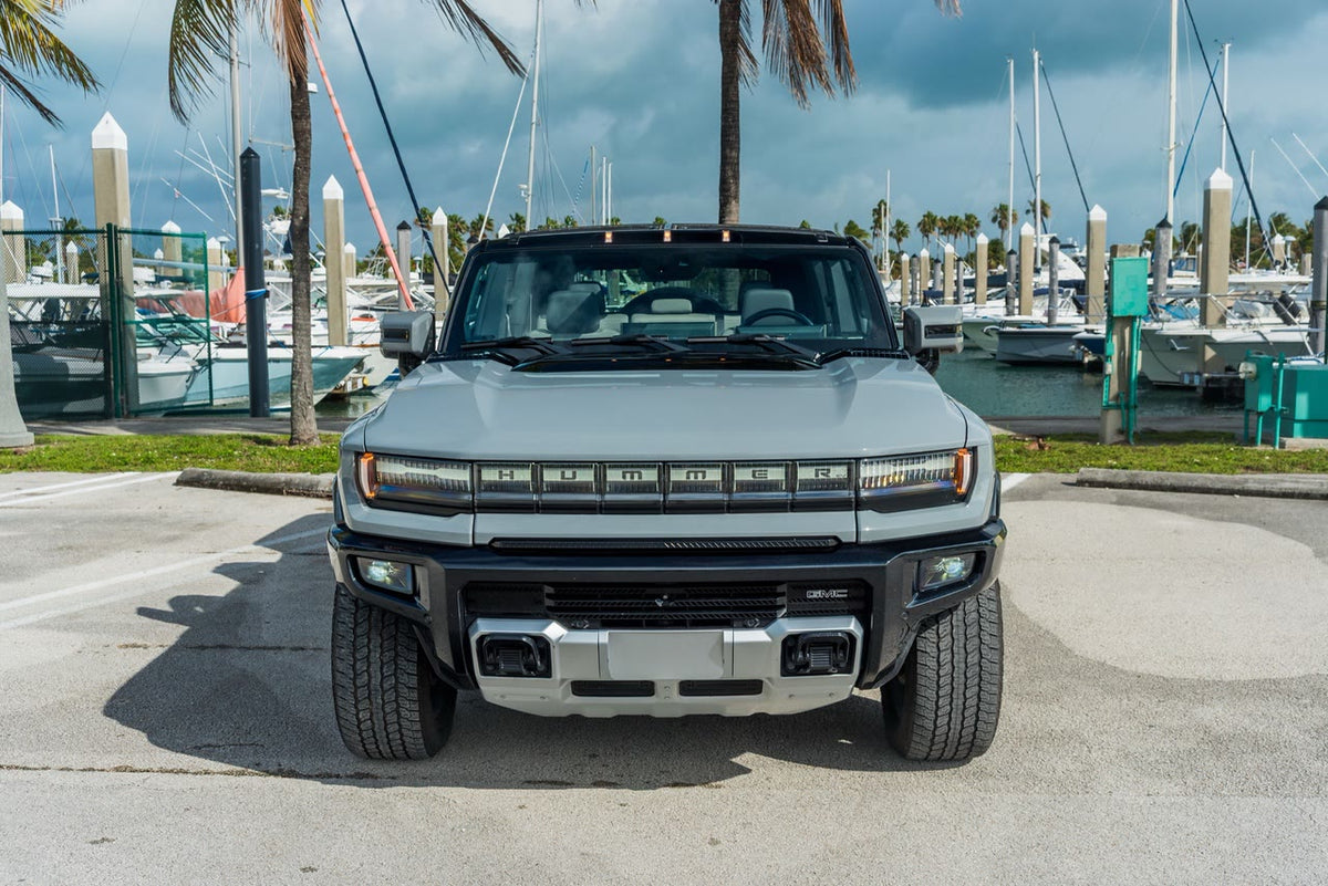 GMC Hummer EV SUV head-on view of the HUMMER light bar and GMC bumper