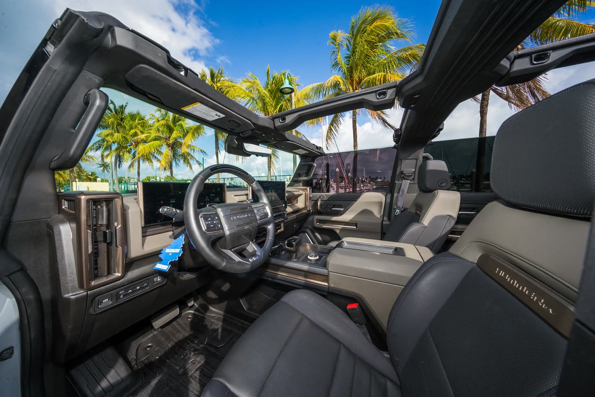 GMC Hummer EV SUV front seats in black and tan leather