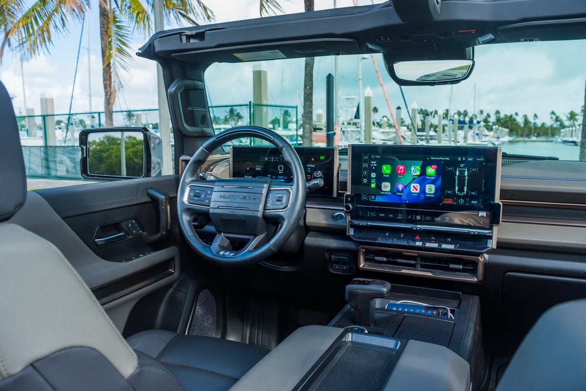 GMC Hummer EV SUV interior with the driver display and the central touchscreen running Apple CarPlay