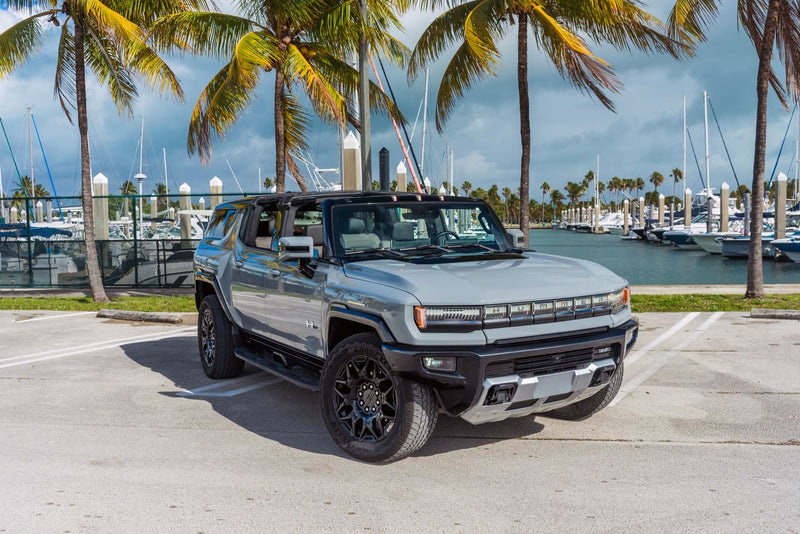 GMC Hummer EV SUV with the Infinity Roof panels removed, parked at a Florida marina